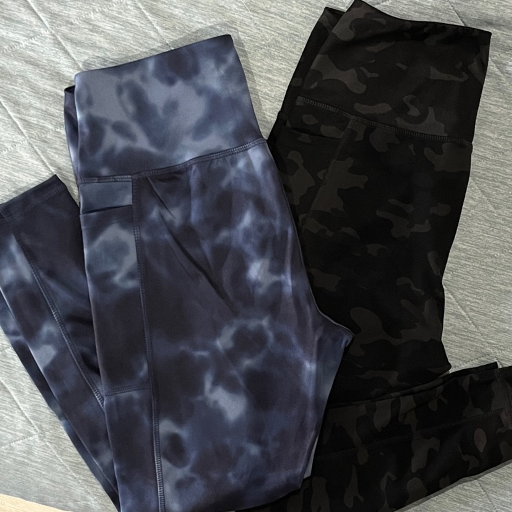 2 pair women’s Danskin active leggings.  Navy blue tie die and black camo